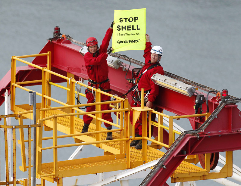 Actress Lucy Lawless, left, joins activists in stopping an oil drilling ship from departing the port of Taranaki, New Zealand.