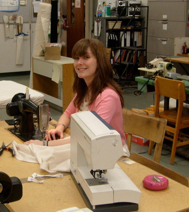 Crystal Gomes sews a costume for a play at Carnegie Mellon University, where she earned a master of fine arts degree.