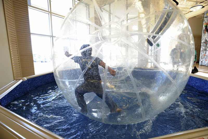 A young boy plays inside a hamster ball at Summit Adventures. Owner Jeff Hunnewell said 21,000 people used the hamster balls in 2011, with only two incidents – both involving knee-to-nose contact – that required ice packs.