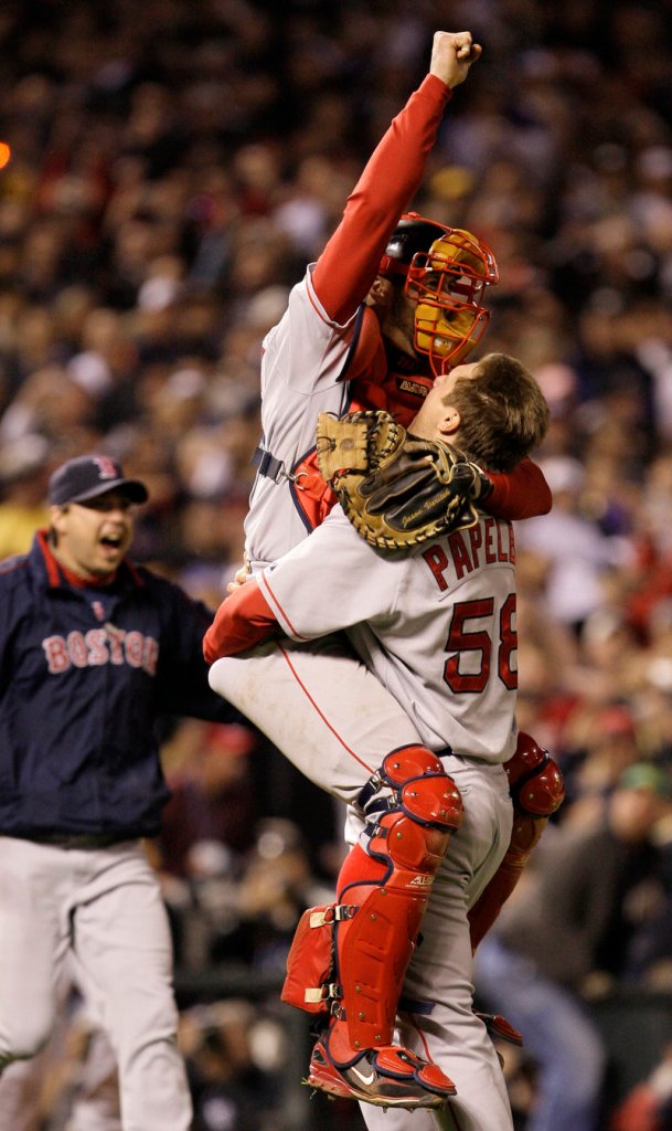 Three years later … it’s time to celebrate again as Jason Varitek jumps into the arms of closer Jonathan Papelbon after another Series sweep.