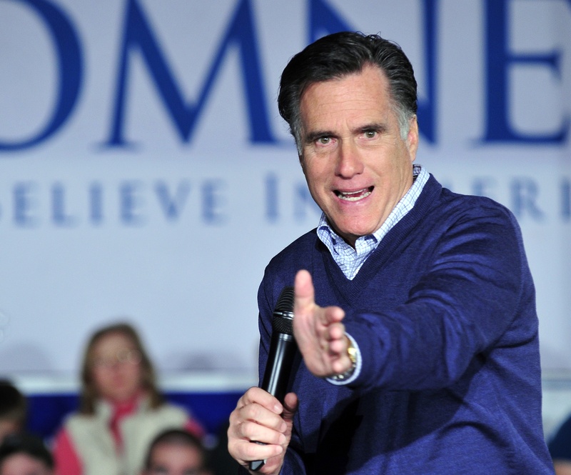 GOP presidential contender Mitt Romney, the former governor of Massachusetts, addresses the crowd at a town-hall meeting at The Portland Co. Marine Complex on Fore Street on Friday night. Romney and one rival, Rep. Ron Paul, R-Texas, will be in Maine today.