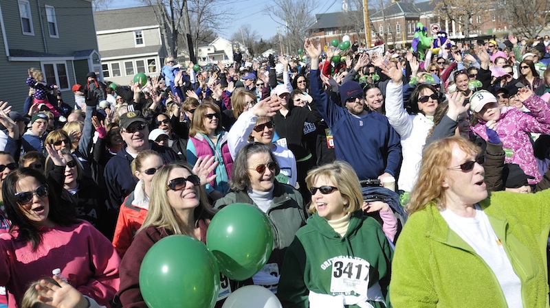 Walkers eager to start cheer moments before the runners race by during Mary’s Walk and Kerrymen Pub 5K race in Saco on Sunday.