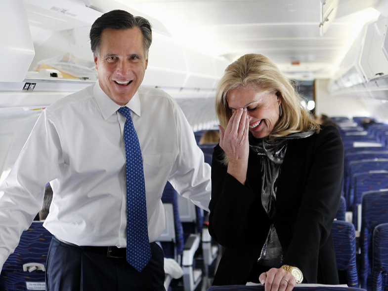 Republican presidential candidate, former Massachusetts Gov. Mitt Romney, and his wife Ann, talk to reporters on his campaign plane before taking off for Boston, in Columbus, Ohio, on Tuesday.