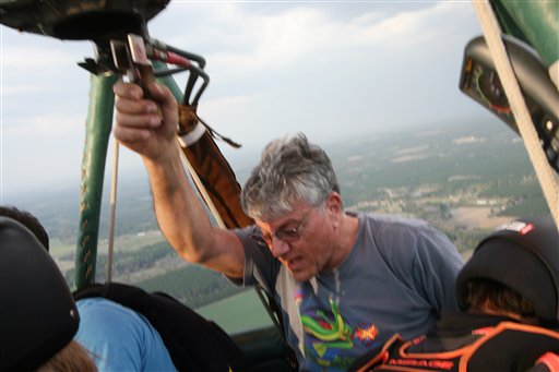 In this Friday, March 16, photo provided by Brian Wesnofske, pilot Ed Ristaino, 63, speaks to skydivers in his hot-air balloon over Fitzgerald, Ga. Later, Ristaino would tell his five passengers to bail out just before a thunderstorm sucked in his craft and sent him plummeting to his death.
