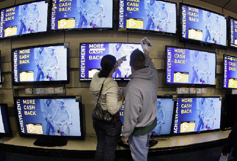 Shoppers look at televisions displayed at a Best Buy in Brentwood, Tenn., recently.