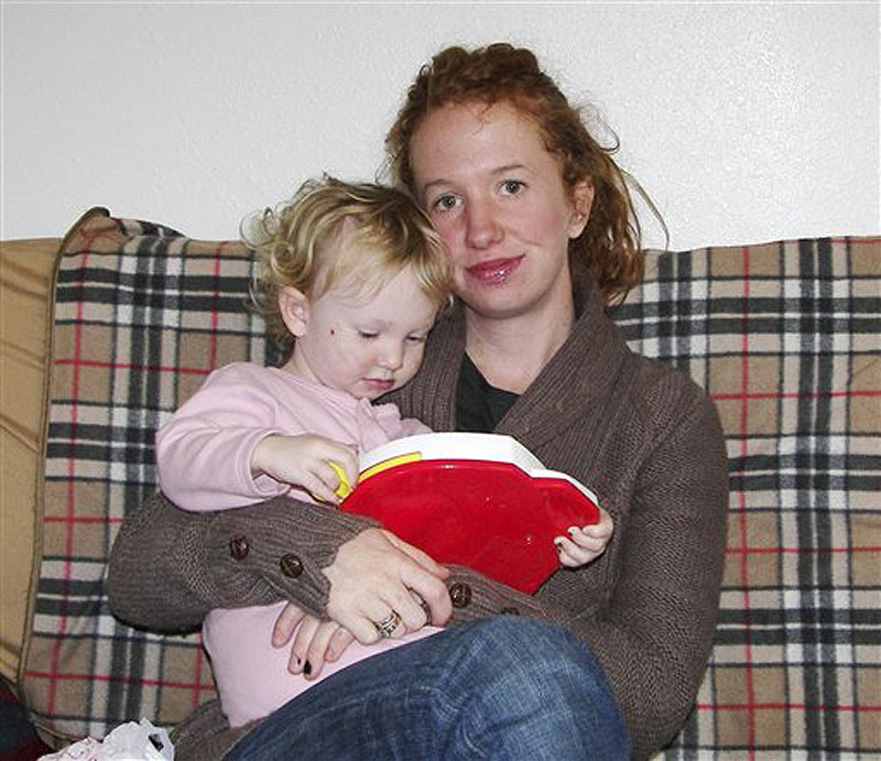 In this undated photo provided by Emily Gillette, she is shown with daughter, River. Gillette, who was asked to leave an airplane for breast-feeding her child in 2006, sparking a day of airport protests nationwide, has reached an out-of-court settlement with the airlines she sued. Gillette of Santa Fe, N.M, says she was kicked off a Delta Connections flight in Burlington, Vt., in 2006 because she wouldn't cover herself with a blanket while nursing her 1-year-old daughter. Gillette had sued Delta Airlines, Freedom Airlines and Mesa Air Group for unspecified compensatory and punitive damages. (AP Photo/Emily Gillette)