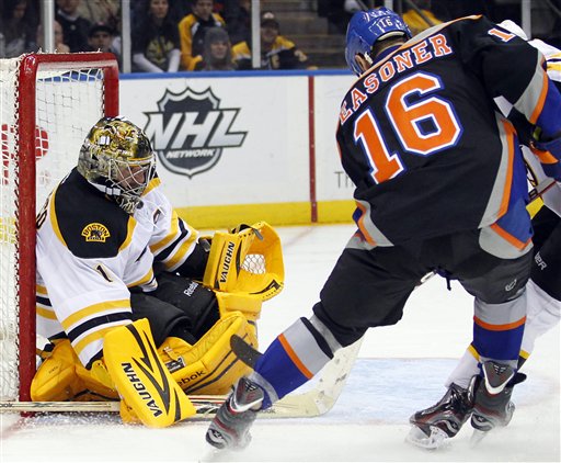 Boston Bruins goalie Marty Turco (1) makes a save on a shot by New York Islanders Marty Reasoner (16) during the second period of an NHL hockey game at the Nassau Coliseum in Uniondale, N.Y. on Saturday, March 31, 2012. The Bruins won 6-3.P Photo/Paul J. Bereswill) Bruins Islanders Hockey