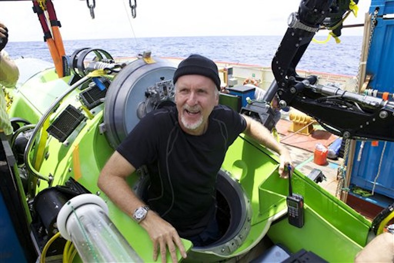 Filmmaker and National Geographic Explorer-in-Residence James Cameron emerges from the Deepsea Challenger submersible after his successful solo dive to the Mariana Trench, the deepest part of the ocean, Monday March 26, 2011. (AP Photo/Mark Theissen, National Geographic) MM8108