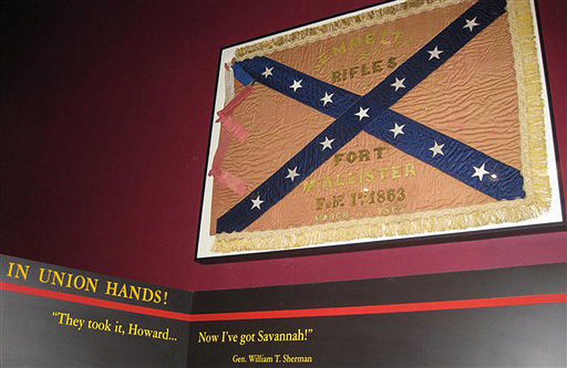 In this Wednesday, March 21, 2012 photo, a Confederate unit flag that belonged to the Emmett Rifles, a Georgia-based company during the Civil War, hangs at Fort McAllister state park in Richmond, Ga., 148 years after the fort fell to Gen. William T. Shermanís army. The flag was captured by a Union officer who left it to his family with a handwritten request that it be returned to Georgia. His great-grandson, Robert Clayton of Islesboro, Maine, donated the flag to the state park, which plans a dedication ceremony in April. (AP Photo/Russ Bynum)