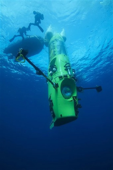 This February 2012 photo provided by National Geographic shows the DEEPSEA CHALLENGER submersible on its first test dive off the coast of Papua New Guinea. Director James Cameron is using the verticle submarine to visit Earth's deepest point, seven miles below the surface. (AP Photo/Mark Thiessen, National Geographic) MM8108