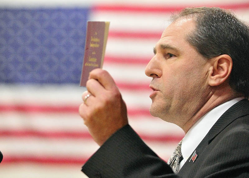 Republican Senate hopeful Scott D’Amboise waves his copy of the Declaration of Independence and the U.S. Constitution at the Maine Republican Caususes in Augusta last month. D’Amboise is running to replace Sen. Olympia Snowe.