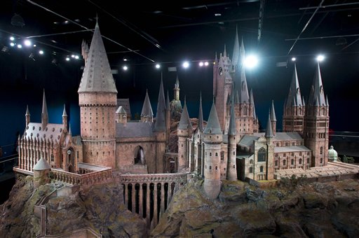 A model of Hogwarts castle from the Harry Potter film series is unveiled at the Warner Bros Studio Tour, Watford, London, Thursday, March 1, 2012. The Hogwarts castle model was built for the first film 'Harry Potter and the Philosopher's Stone', it was created for aerial photography and was digitally scanned for CGI scenes. It took 86 artists and crew members to construct, it measures over 50 feet in diameter and has over 2,500 fibre optic lights. (AP Photo/Jonathan Short)