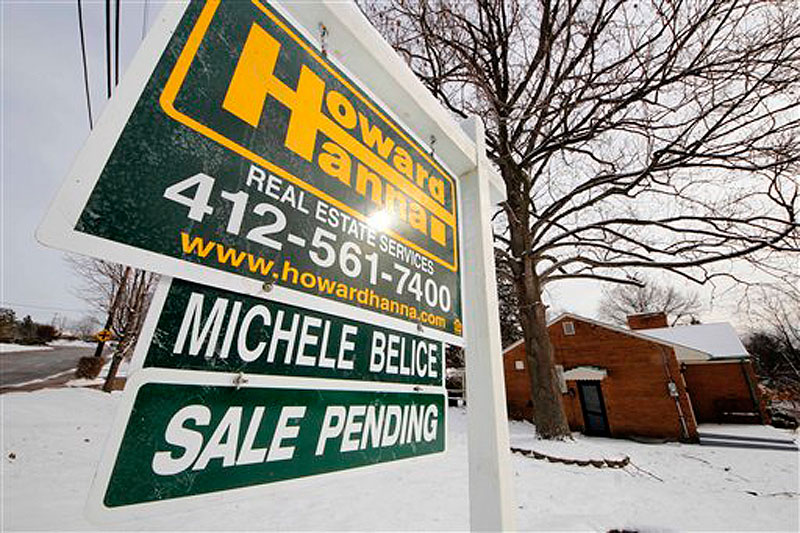 This Jan. 20, 2012 photo shows a home with a sale pending sign, in Mount Lebanon, Pa. The number of Americans who signed contracts to buy homes rose in January to the highest level in nearly two years, supporting the view that the housing market is gradually coming back. (AP Photo/Gene J. Puskar)