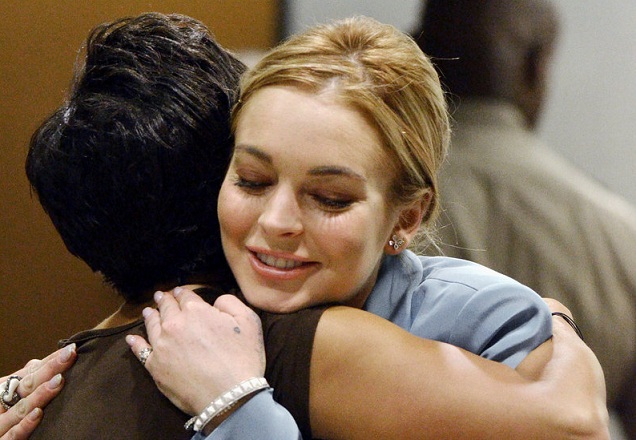Lindsay Lohan embraces her attorney after a progress report on her probation at Los Angeles Superior Court Thursday. The judge told her to focus on her work.