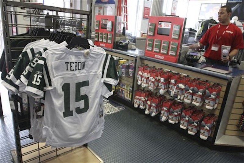 New York Jets football jerseys with the name and number of their new quartback Tim Tebow are on display at a Modell's store on Friday, March 23, 2012 in New York. Tebow was traded Wednesday, March 21, 2012, to the Jets from the Denver Broncos. (AP Photo/Mary Altaffer)