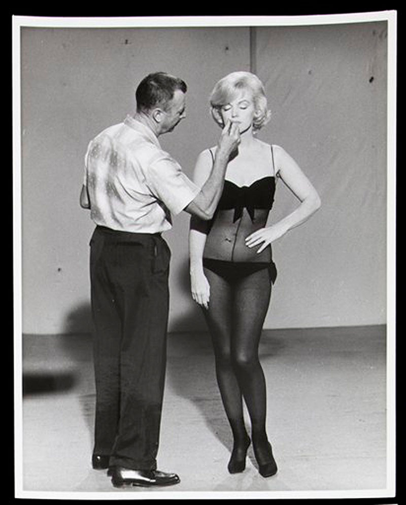 This image, taken in 1960, released by Julien's Auctions, shows a black and white photograph of Allan "Whitey" Snyder applying Marilyn Monroe's makeup on the set of "Lets Make Love." This item is part of Julien's Auctions Hollywood Legends being held on Saturday, March 31, 2012 and Sunday April 1 in Beverly Hills, Calif. (AP Photo/Julien's Auctions)