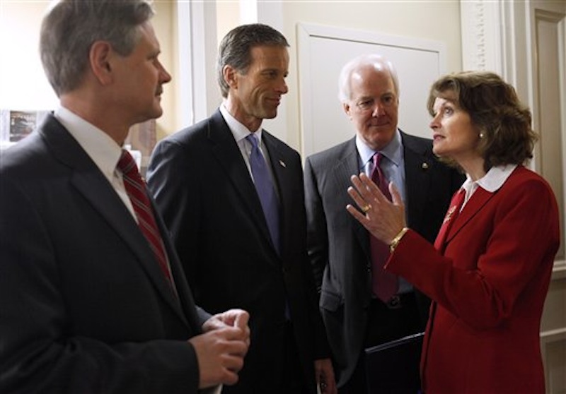 In this Feb. 29, 2012 photo, Republican Sen. Lisa Murkowski, R-Alaska, talks Republican Senators, from left, John Hoeven, R-N.D., John Thune, R-S.D., and Sen. John Cornyn, R-Texas, prior to a news conference on gas prices on Capitol Hill in Washington. Murkowski, 54, a moderate in an era of paralyzing partisanship, may be a natural heir to the centrist role played by retiring Maine Sen. Olympia Snowe at a time when their party is hurting for female leaders. (AP Photo/Jacquelyn Martin)