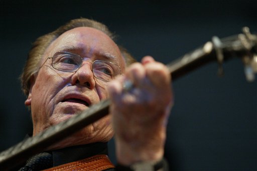 A June 10, 2005, photo of Earl Scruggs performing at the Bonnaroo Music & Arts Festival in Manchester, Tenn.