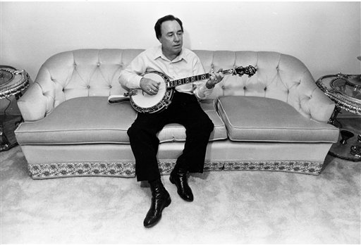 In this photo 1982 photo, bluegrass legend and banjo pioneer Earl Scruggs plays his banjo.