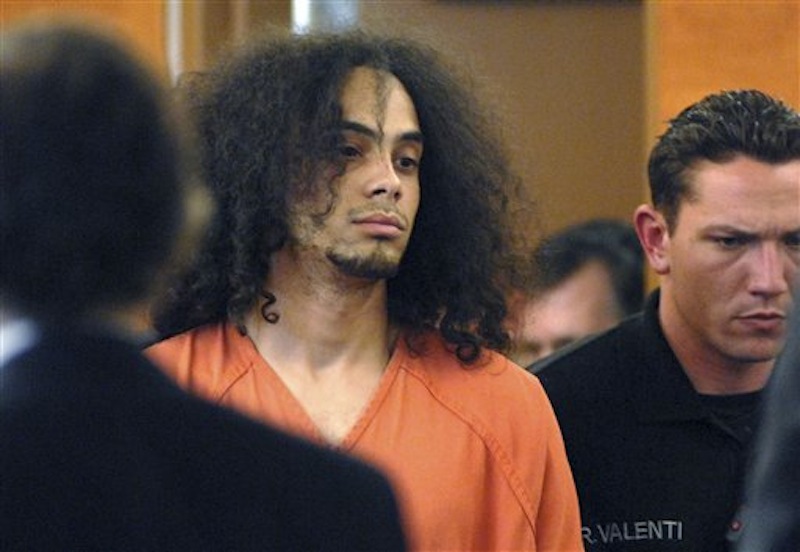 Myles Webster, 22, of Litchfield, N.H., is led into circuit court for arraignment in Manchester, N.H. on Thursday, March, 22, 2012. Webster is charged with attempted murder in the shooting of Manchester police officer Daniel Doherty Wednesday night. Bail was set at $1 million. (AP Photo/Union Leader, David Lane, Pool)