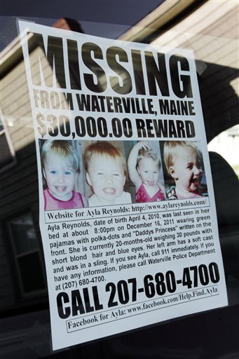 A poster showing missing toddler Ayla Reyolds hangs in the back window of Jeff Hanson's truck at his home in Portland on Tuesday.