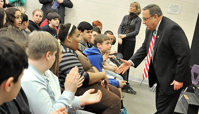 RETURN TO WATERVILLE: Gov. Paul LePage shakes hands with eighth-graders at Waterville Junior High School on Wednesday. Gov. LePage was the keynote speaker for Career Conversations, a five-week program at the junior high that featured talks from career professionals. The former Waterville mayor told students about the rewards and challenges of being governor.