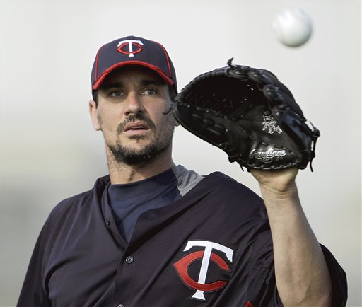 Minnesota Twins pitcher Carl Pavano works out during baseball spring training in Fort Myers, Fla., in this Feb. 21, 2012, photo.