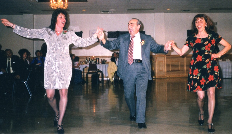 During his 50th wedding anniversary party in 1999, Raymond S. Amergian dances with his daughters, Denise Ludka of Windham, left, and Sheila Carver of Winslow.