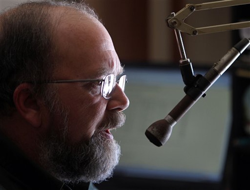 In this March 7, 2012 photo, Tony Vazzano does one of his many radio shows, in Sandwich, N.H. Vazzano is a meteorologist and owner of North Winds Weather, which supplies ski areas with daily, individualized weather reports before the chairlifts begin their ascent. (AP Photo/Jim Cole)