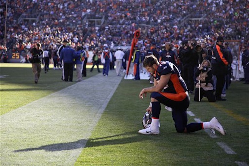 In this Dec. 11 photo, Denver Broncos quarterback Tim Tebow prays in the end zone before the start of a game against the Chicago Bears. Tebow was traded to the New York Jets on Wednesday, March 21, 2012. (AP Photo/Julie Jacobson)