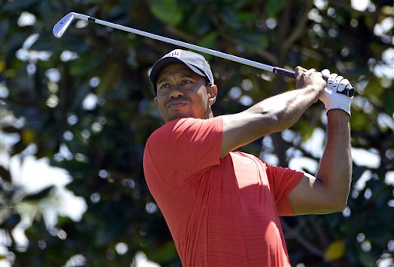 Tiger Woods hits from the second tee during the final round of the Arnold Palmer Invitational golf tournament at Bay Hill on Sunday, March 25, 2012, in Orlando, Fla. After 30 months, Woods is a winner once again. (AP Photo/Phelan M. Ebenhack)