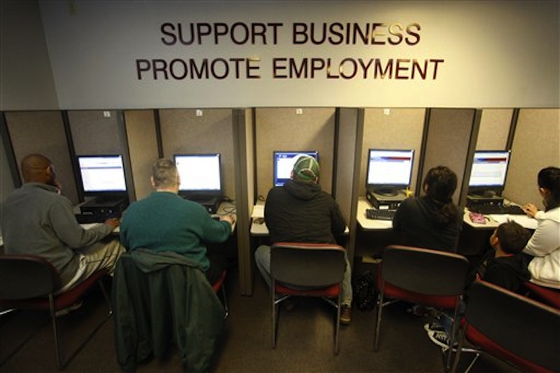 Job seekers look for jobs at WorkSource Oregon Monday, Feb. 28, 2012, in Salem, Ore. (AP Photo/Rick Bowmer)