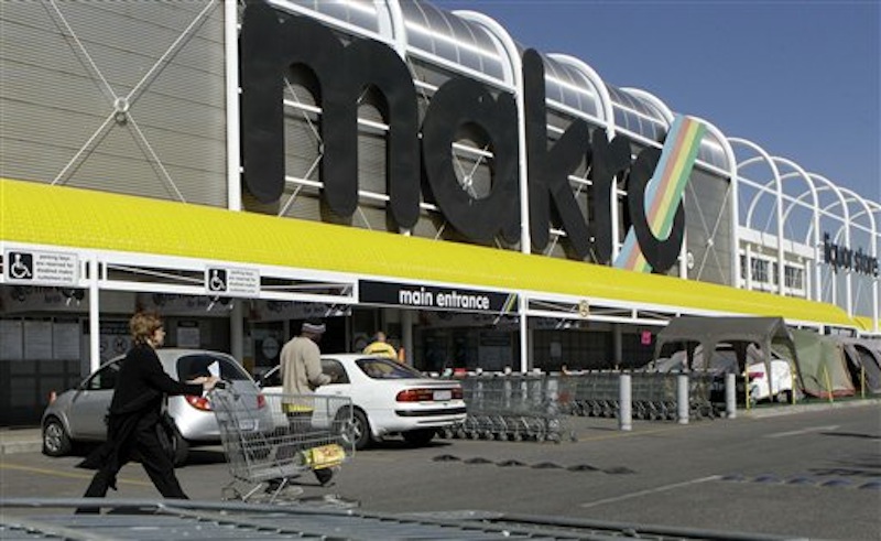 In this photo taken Tuesday May 31, 2011 a customer pushes a trolley outisde the Makro store in Johannesburg. Wal-Mart, the world's biggest retailer, can go ahead with its 17 billion rand ($2.2 billion) purchase of a controlling share of the South African chain, a South African regulatory appeals body said Friday March 9, 2012. (AP Photo/Themba Hadebe)