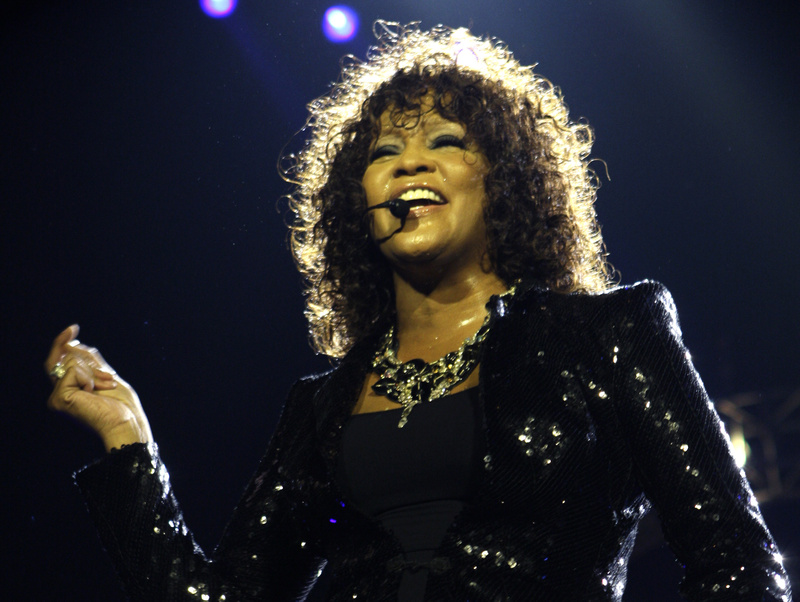 In this April 25, 2010 file photo, singer Whitney Houston performs in London. Coroner's officials said Thursday that Houston drowned, but her death was also caused by heart disease and cocaine use that suggested she was chronically using the drug. Houston died Feb. 11 in California at the age of 48.