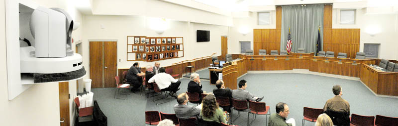 This composite made from two photos shows the City Council Chamber in Augusta’s City Center which features four remote control video cameras like the one at far left used to show meetings held there.