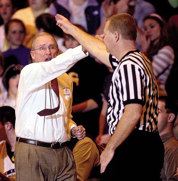 In this 2007 photo, Jim Bessey, then-coach at Mount Blue, signals for possession of the ball during a game in Farmington on his way to his 400th career victory.