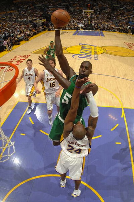 Boston Celtics forward Kevin Garnett dunks over Los Angeles Lakers guard Kobe Bryant. The Celtics and Lakers renew their historic rivalry today at 3:30 p.m.