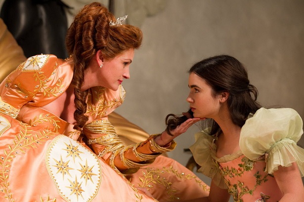 Julia Roberts portrays the evil queen, left, and Lily Collins portrays Snow White in a scene from Relativity Media's "Mirror Mirror."