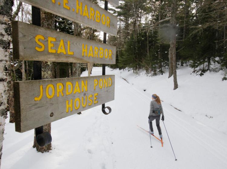 In this January 2010 photo, Abigail Curliss of Southwest Harbor skis alongside Eagle Lake on a carriage road in Acadia National Park.
