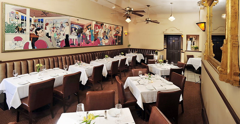 The dining room at the Back Bay Grille is quiet and intimate, decorated with warm colors and furnishings that include surprisingly comfortable banquettes. Adjoining the dining room is a bar/lounge section fronting the wide-open kitchen.
