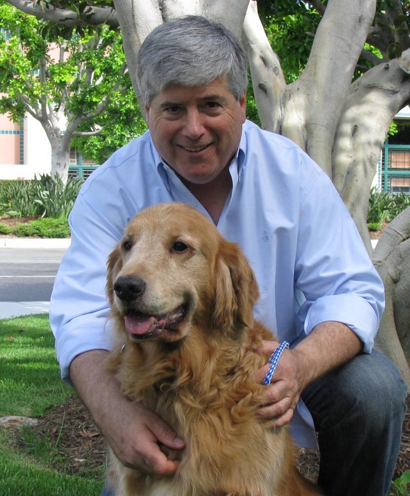 David Rosenfelt and one of his 28 rescued dogs.