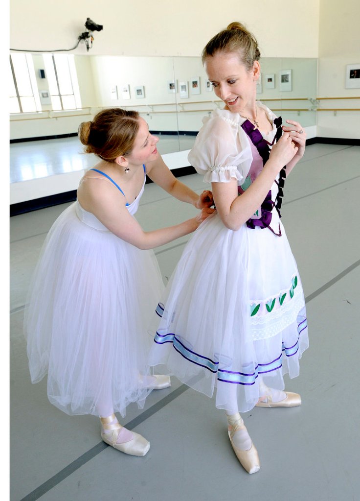 Megan Buckley helps Jennifer Jones dress for rehearsal at Portland Ballet. The two share the lead role in “Giselle.”
