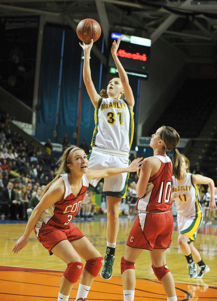 Olivia Smith, a sophomore who scored a game-high 15 points for McAuley in its 54-41 victory against Cony in the Class A final, finds room in the lane to loft a short jumper.