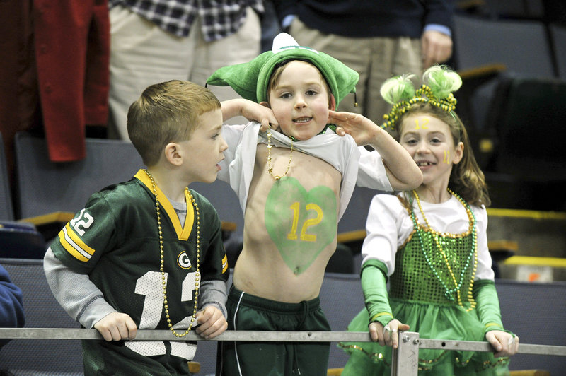 The young fans for McAuley were quick to show their support for their favorite player – senior Sadie DiPierro, who wears No. 12. From left to right are Brett McCaffey, Seamus Jennings and Calli Jennings.