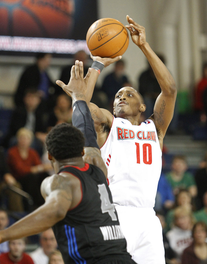 Kenny Hayes hits a 3-pointer on his way to a Red Claws-record 52 points Sunday at the Expo.