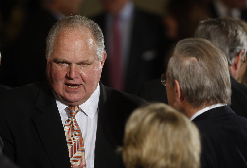 The company that hosts Rush Limbaugh’s talk show says it’s standing by Limbaugh, above, who apologized Saturday for his derogatory comments regarding a law student who testified about birth control policy.