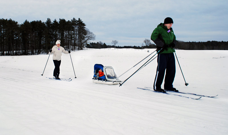 Brenda and Matt Ciardiello of Portland give their son, Roman, a taste of winter in Maine. The Ciardiellos had been waiting for a chance to learn how to cross-country ski since moving to Maine from Texas last year.