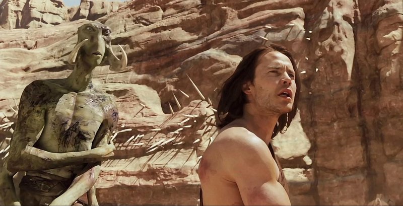 Taylor Kitsch with a Thark in “John Carter.”