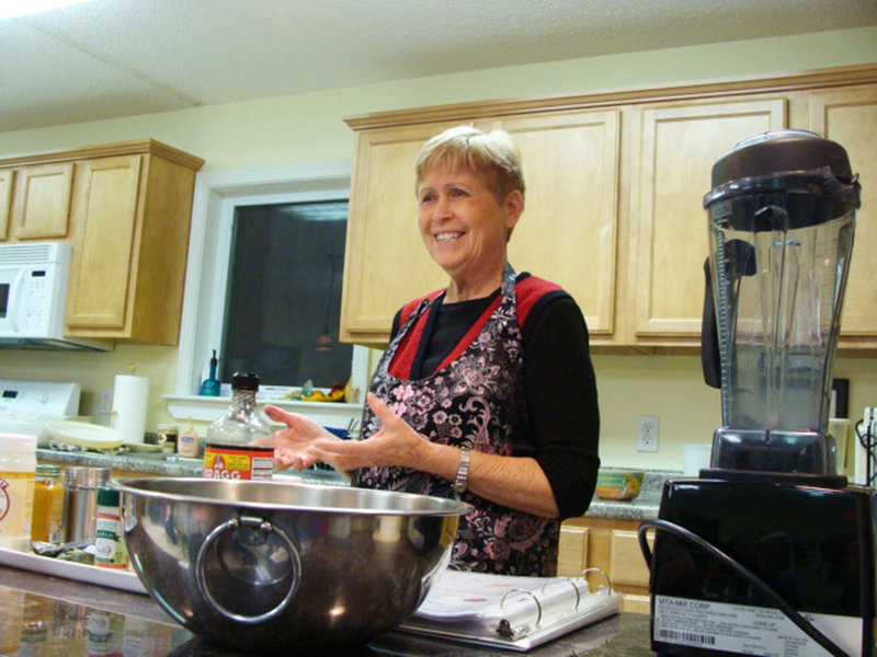 Kitty Johnson demonstrates plant-based cooking techniques during a recent class.