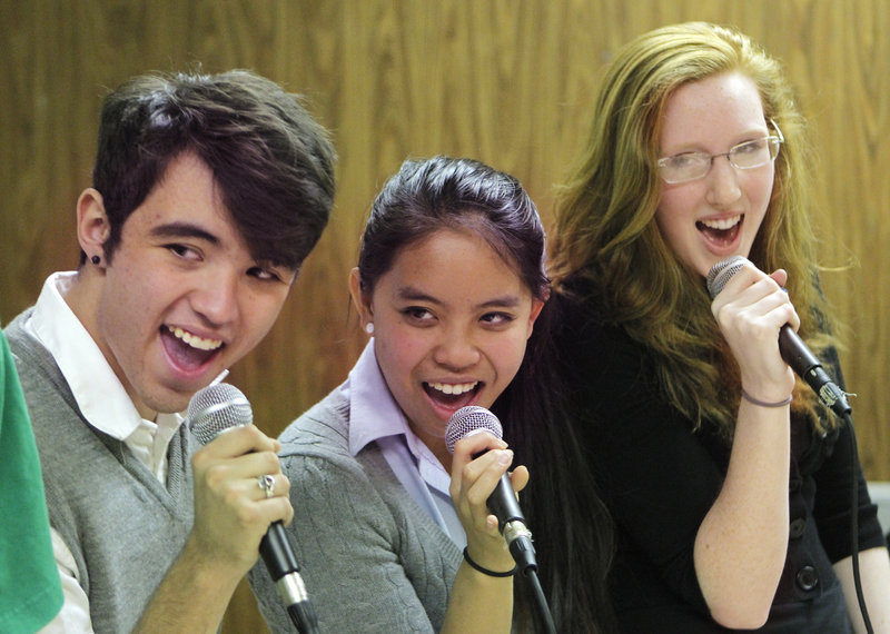 From left, Jake Boyce, Samantha SaVaun and Erin Fitzpatrick rehearse Monday as part of Cheverus High School’s a cappella jazz group Soulstice. The ensemble placed third last year in the Berklee College of Music’s Annual High School Jazz Festival.